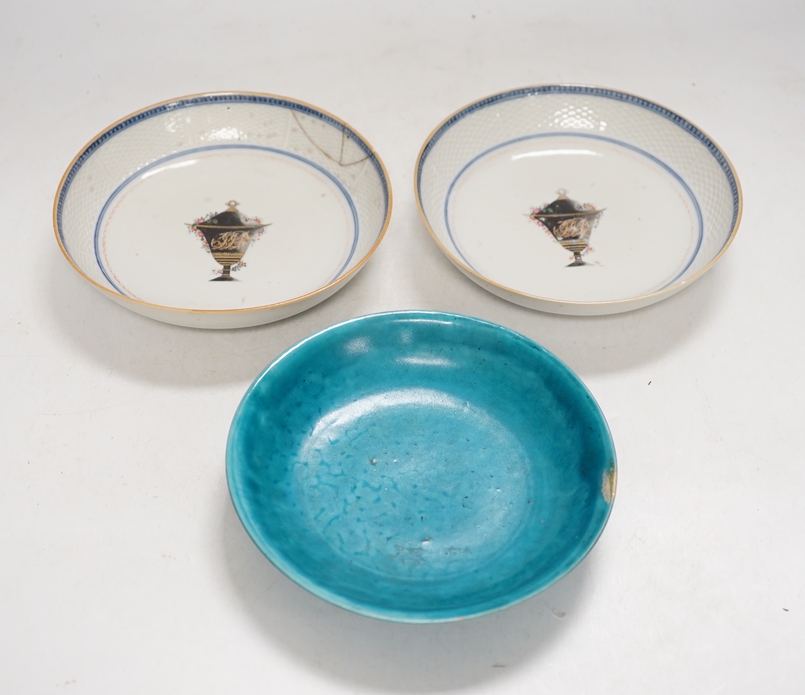 A Chinese turquoise glazed saucer dish, Qianlong Mark and period and two Chinese export famille rose saucers, Qianlong period, 16cm diameter